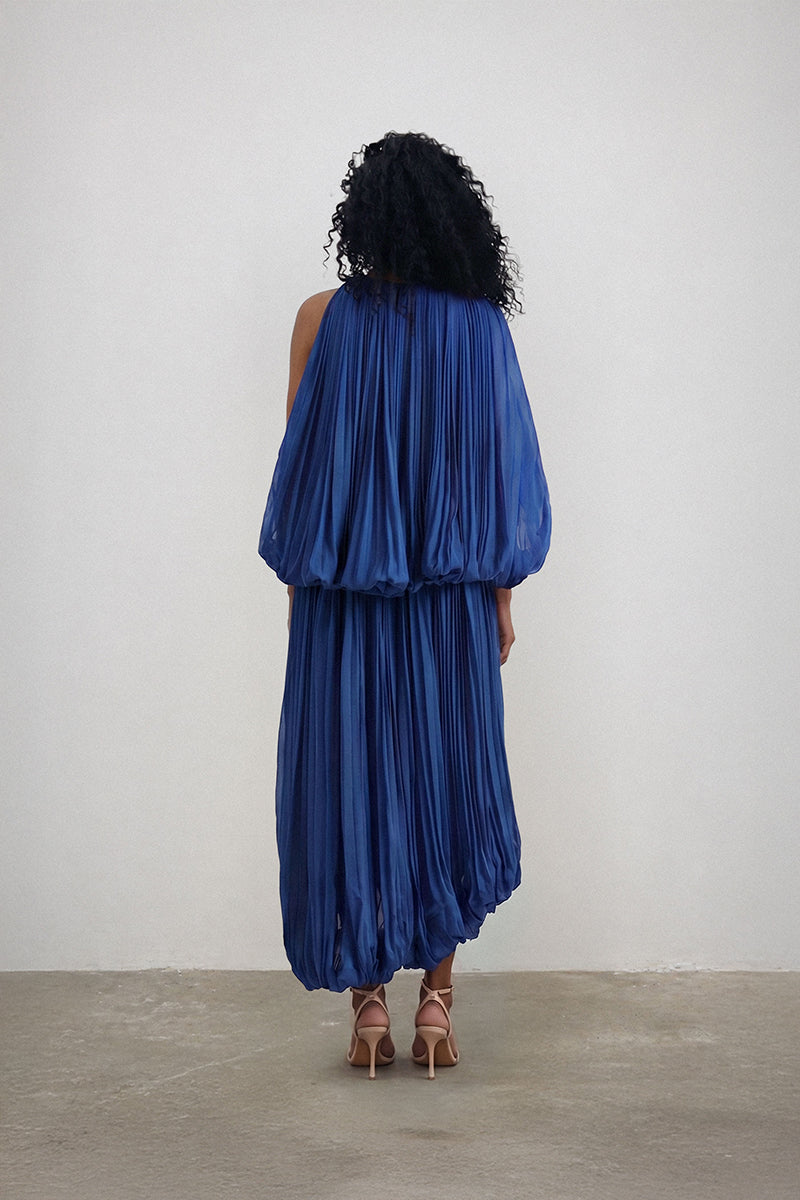 Deme By Gabriella indigo co-ordinate set featuring a stylish top and matching pants displayed on a hanger.