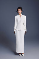 White zipper corset pencil skirt from Keira Tong, styled as a maxi skirt with a fitted silhouette and front zipper detail.