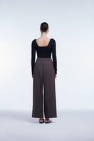 Dāl the Label relaxed wide-leg cropped pants in soft fabric, showing their loose fit and stylish design.