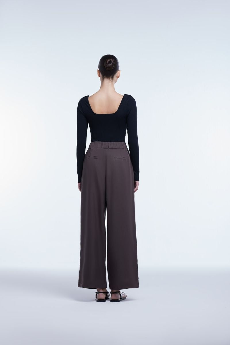Dāl the Label relaxed wide-leg cropped pants in soft fabric, showing their loose fit and stylish design.