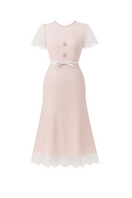 White Plan PRUCEL midi dress displayed on a hanger, showcasing its elegant, flowing fabric and stylish design.