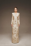 Elegant Margée Atelier Aurelia Brocade Gown with intricate patterns and luxurious fabric, showcased on a model.