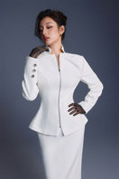 White zipper peplum top by Keira Tong featuring a fitted silhouette and front zipper detail, styled on a model.