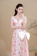 Do Long Peach Blossom Gown with flowing fabric and floral design, elegant dress for special occasions.