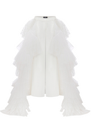White crepe pants with ruffled train by Sudi Etuz, featuring wide-leg style and elegant, flowy fabric.