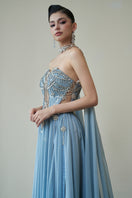 HACCHIC COUTURE Venus gown in vibrant blue, elegant evening gown with flowing fabric and intricate details.