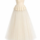 White Plan Anderson gown displayed on a hanger, featuring elegant fabric and a classic design suitable for formal occasions.