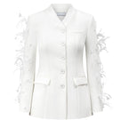 White Jane blazer by Arti Apparel displayed on a hanger, showcasing tailored fit and classic lapel design.