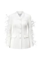 White Jane blazer by Arti Apparel displayed on a hanger, showcasing tailored fit and classic lapel design.