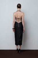 Do Long Chronique midi dress in soft fabric with a fitted waist and flowing skirt, stylishly displayed on a hanger.