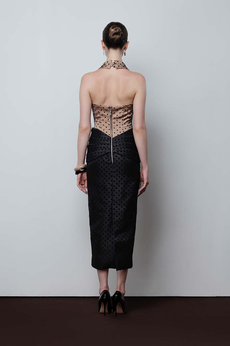 Do Long Chronique midi dress in soft fabric with a fitted waist and flowing skirt, stylishly displayed on a hanger.