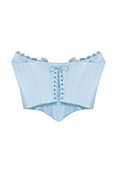 IKINITA NAMI Corset top displayed on a hanger, featuring a fitted design with lace-up front and adjustable straps.