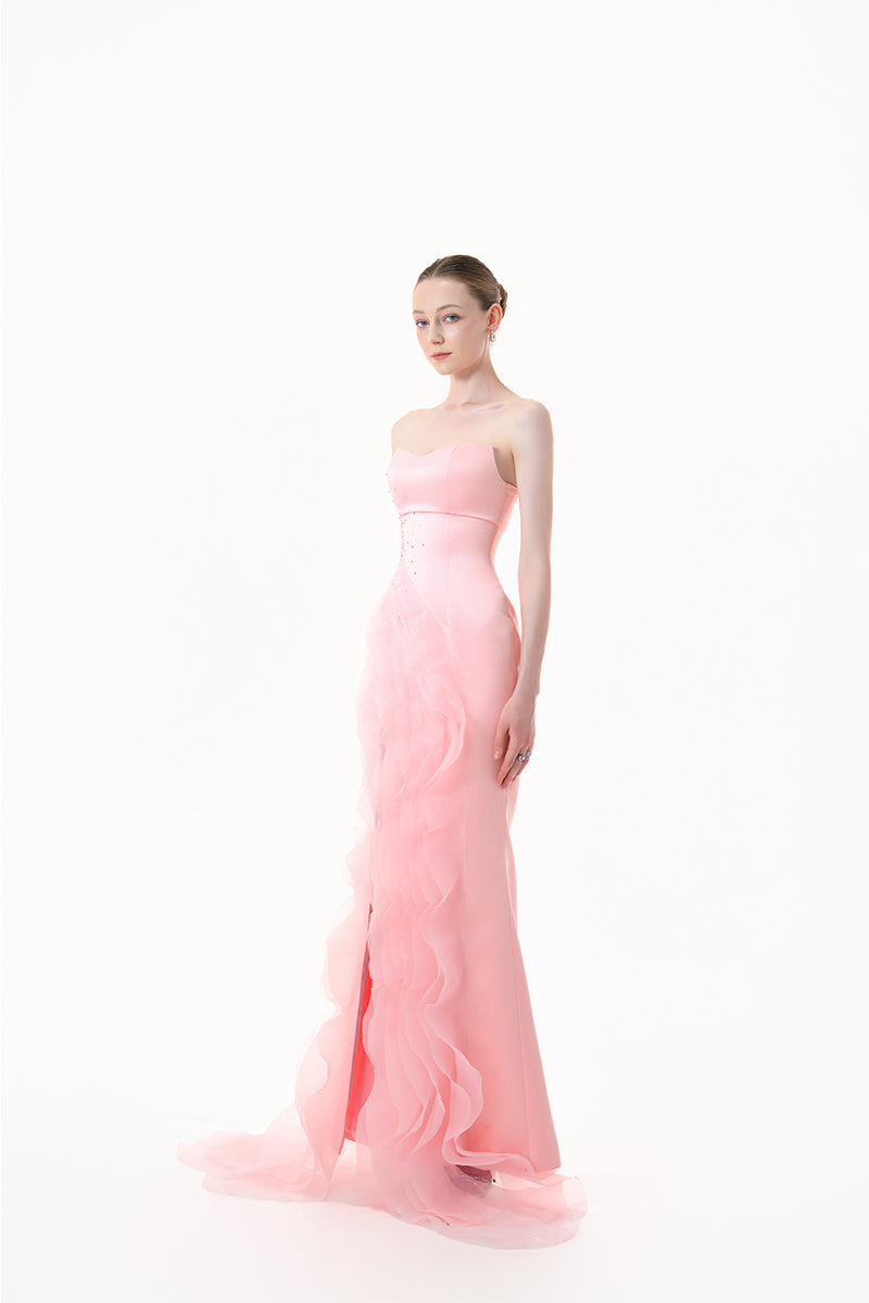 Blush pink strapless ruffle slit gown by Happy Clothing, flowing fabric with elegant ruffle details and high slit for formal occasions.