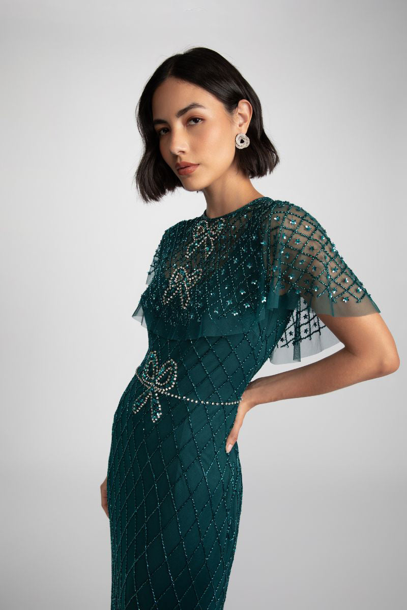 Elegant black Nina gown by Raishma featuring a flowing silhouette and intricate detailing on the fabric.