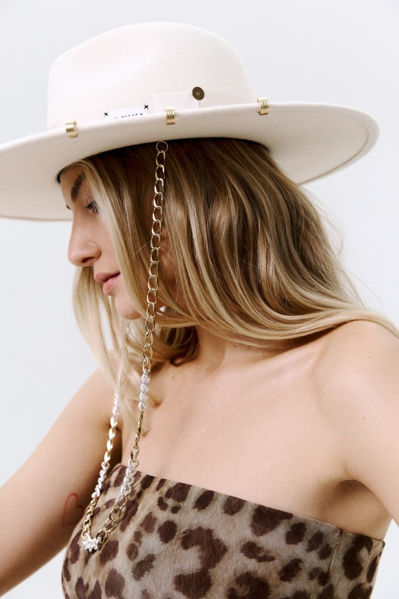 Ecru gold London hat by LE SH KA with 24K gold-plated accessories, featuring a stylish wide-brim design and elegant detailing.