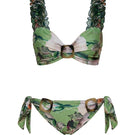 Nur Karaata Blossom Bikini with floral pattern, featuring triangle top and matching bottoms, on a sandy beach setting.