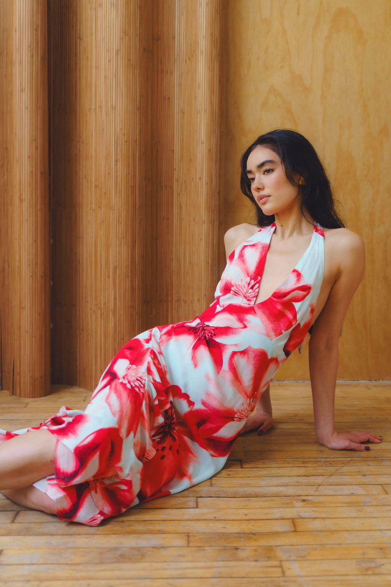 Summer Away Zerina Coral floral midi dress displayed on a hanger with vibrant coral and floral pattern.