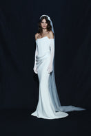 Elegant BALYKINA HOPE GOWN with intricate lace and flowing fabric, showcased on a mannequin.