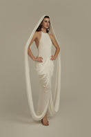 White POEM Elara maxi dress, flowing fabric with elegant design, perfect for summer or special occasions.