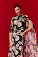 Nur Karaata Marianne Maxi Dress displayed on a model, featuring a flowing silhouette and elegant design perfect for summer occasions.