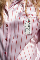 Pink stripe silk pajama set by Not Just Pajama featuring a long sleeve top and matching pants from the Museum of Crush collection.