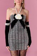 Nur Karaata Vivienne Rose mini dress featuring a floral print and fitted silhouette, displayed on a mannequin.