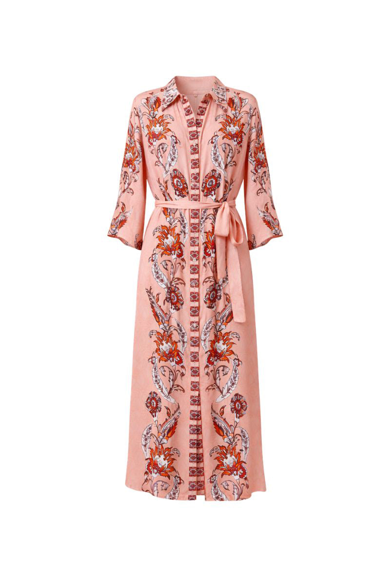 Raishma Sasha pink midi dress displayed on a hanger, showcasing its elegant design and vibrant color.