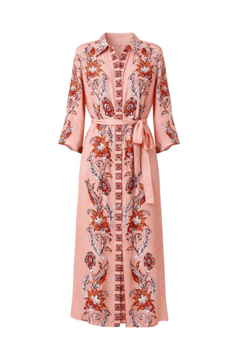 Raishma Sasha pink midi dress shown on a model, featuring a fitted waist and elegant flowy fabric.