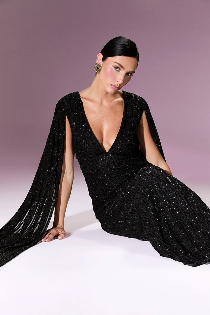 Elegant Nur Karaata GIOVANNA GOWN with flowing fabric and intricate details, displayed on a mannequin.