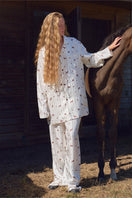 Unisex brown print twill pajamas set from Not Just Pajama, featuring comfortable long-sleeve top and matching pants.