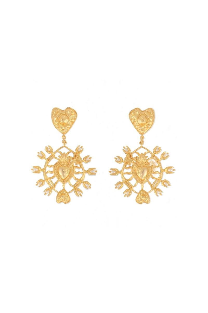 Anatina Majorca earrings, stylish dangle earrings with intricate gold-tone design, hanging from a display.