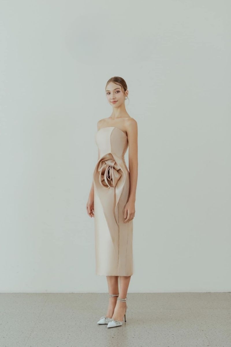 HACCHIC COUTURE Rosie Gold Pencil Midi Dress displayed on a hanger, featuring a fitted silhouette and elegant gold color.