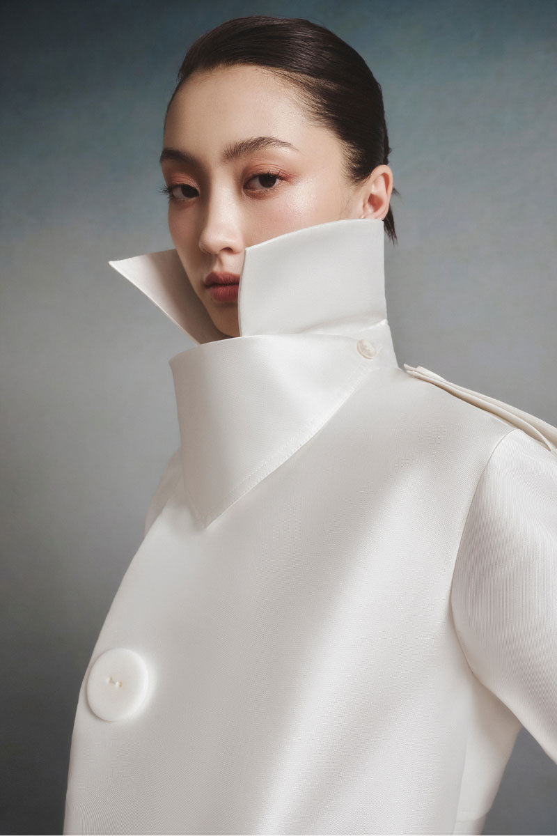 White Plan Aurora Sculpted Jacket featuring a fitted design, high collar, and sleek silhouette, ideal for stylish cold-weather wear.