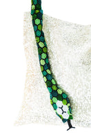 Serpent Big shoulder bag by SAC DE SOUL in white silver with green tones, featuring a textured snake pattern and sleek design.
