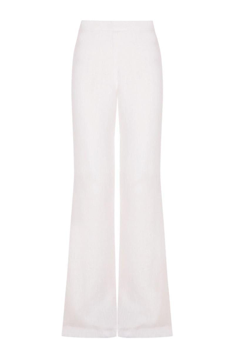 White organic linen flared pants by JC Pajares, showing the relaxed fit and flowing fabric of the stylish pants.