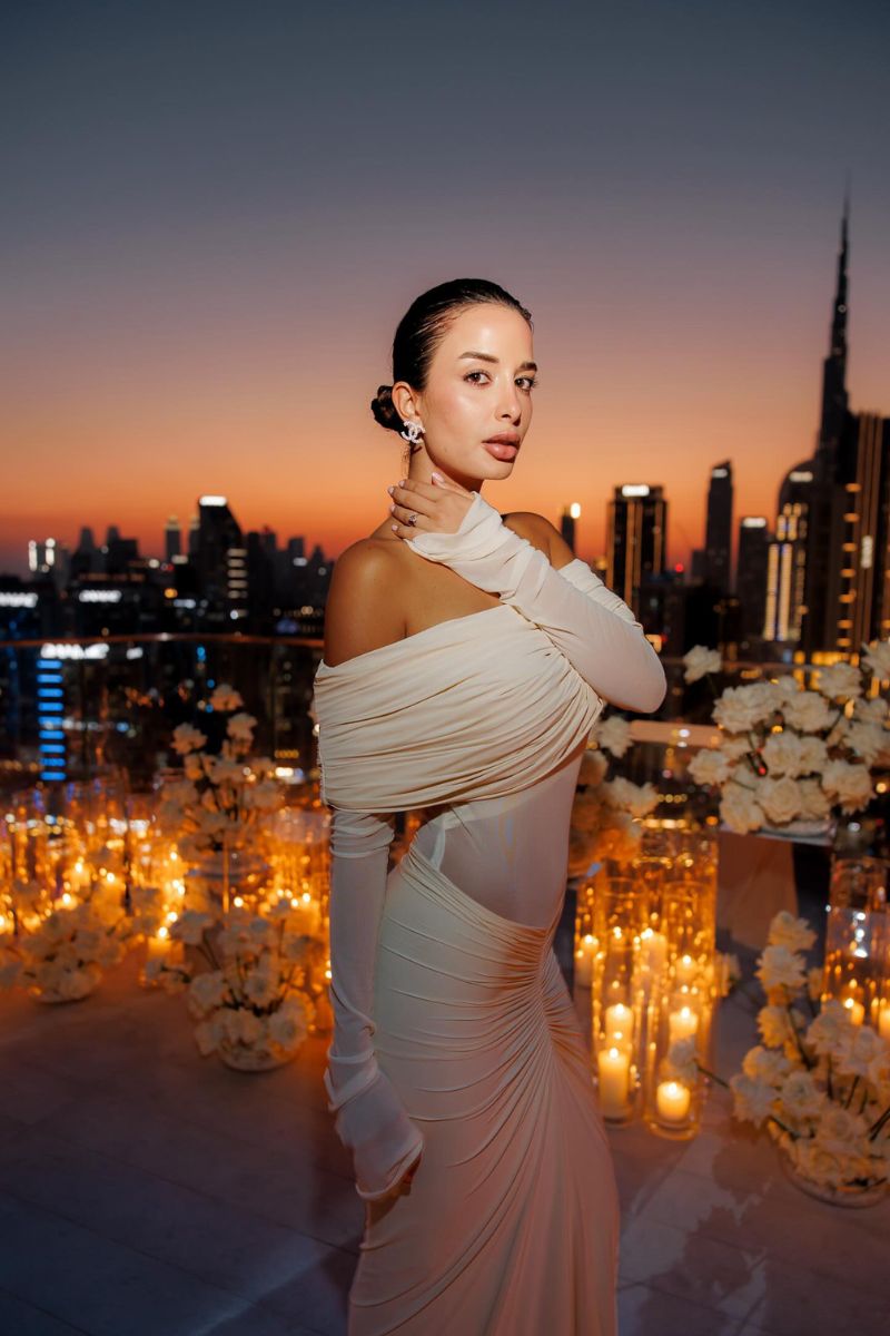 Deme By Gabriella Jolene off-shoulder ruched gown in elegant fabric, featuring a fitted bodice and flowing skirt.