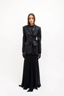 Black leather maxi skirt by Vaska featuring a long, flowing design and smooth fabric, perfect for stylish casual or dressy wear.