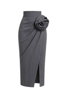 Keira Tong twisted floral midi skirt with a vibrant floral pattern and flowing fabric, showcased in the image.