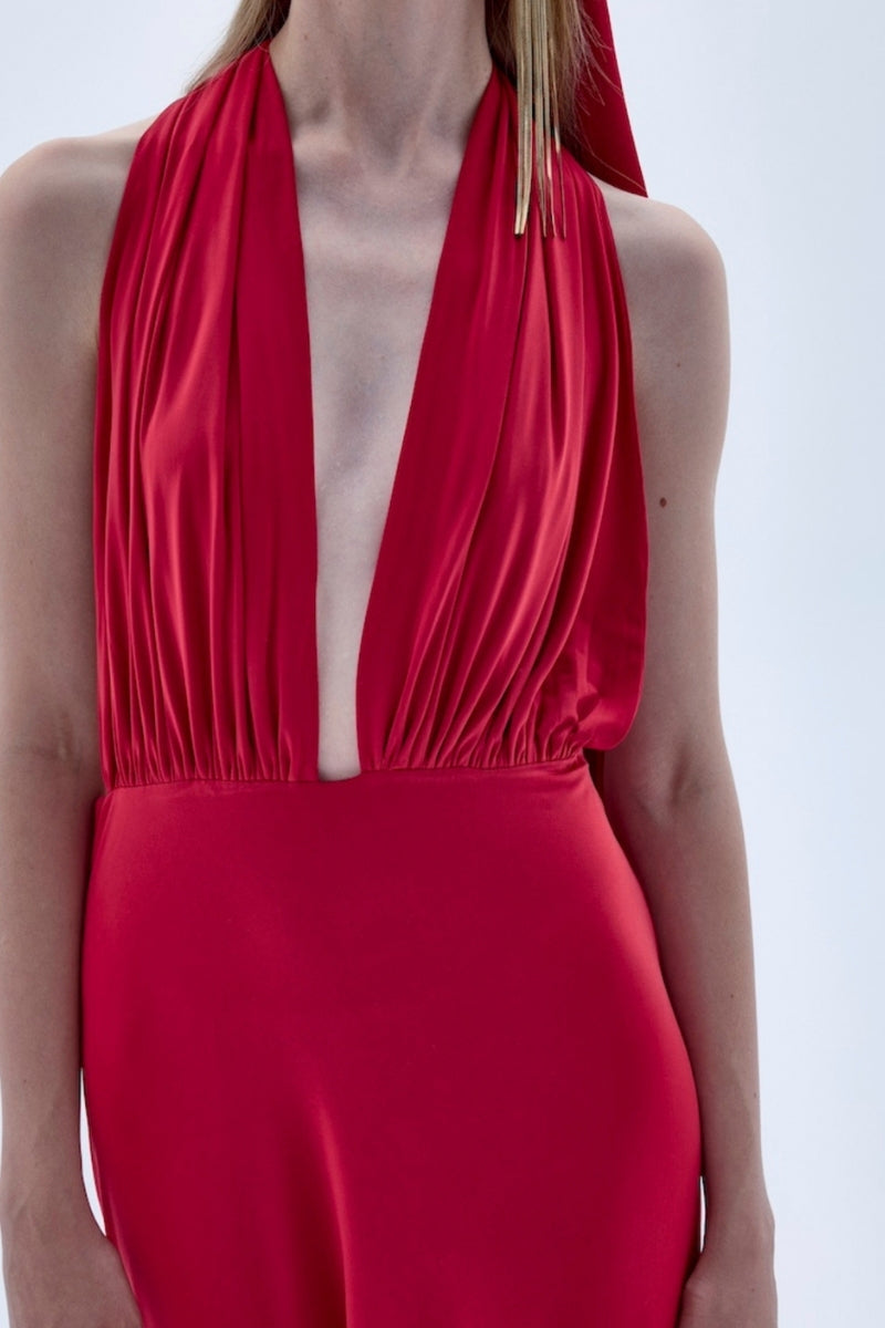 Nazlı Ceren INES long red jersey maxi dress displayed on a model, featuring a flowing silhouette and elegant design.