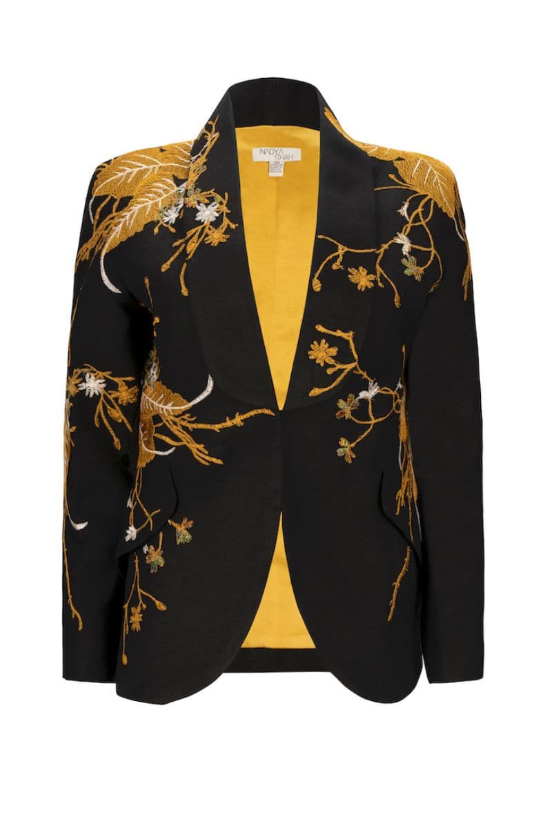 Nadya Shah Ines The Golden Age blazer in gold with structured fit and stylish lapels, showcased on a hanger.