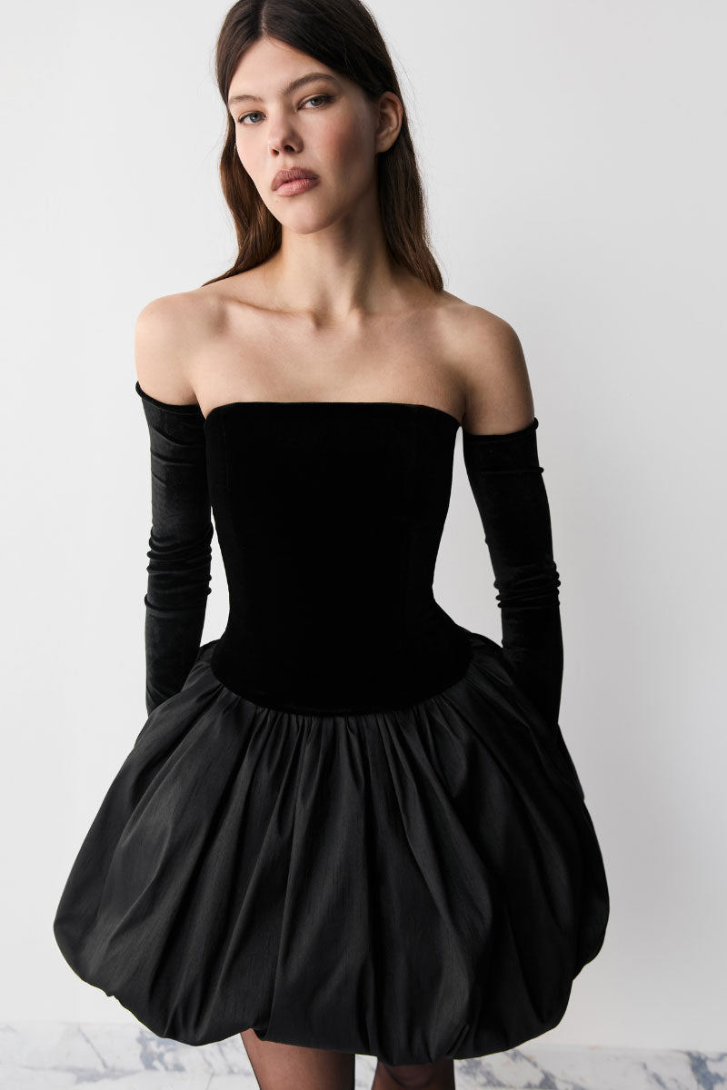 Black BALYKINA Transformer midi skirt with a sleek, fitted design and subtle pleats, perfect for stylish everyday wear.