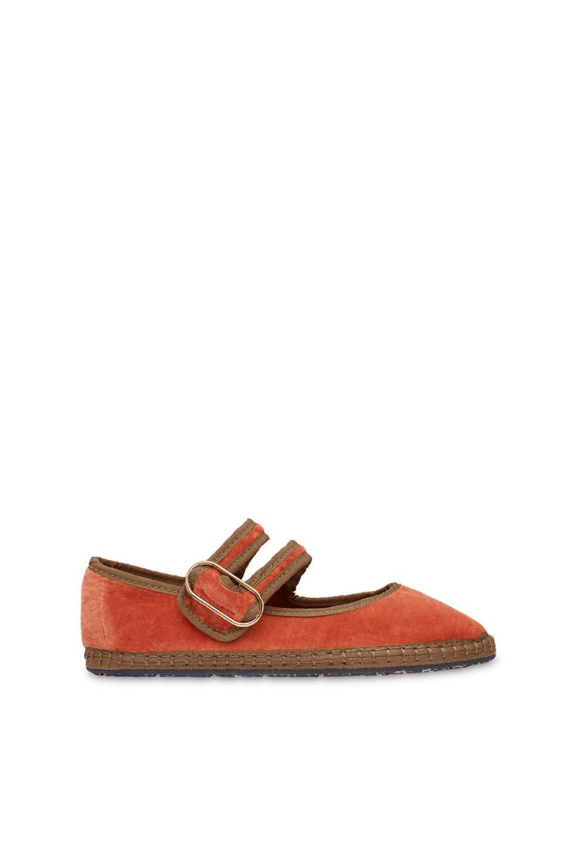 Flabelus Matilda flats in orange with dark green piping, showcasing stylish slip-on footwear with a sleek design.