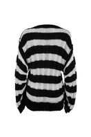 Two-tone knitted sweater by MAZ Manuela Álvarez, featuring a cozy, stylish design in soft, contrasting colors.