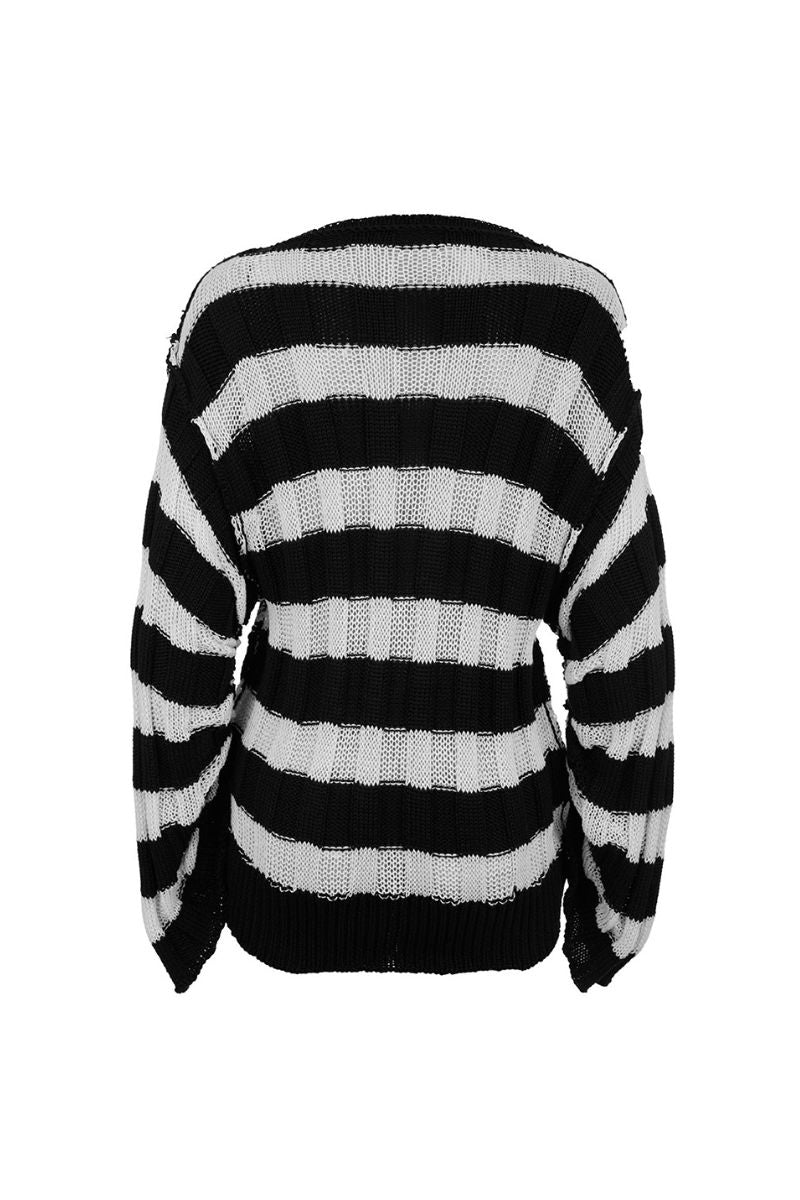 Two-tone knitted sweater by MAZ Manuela Álvarez, featuring a cozy, stylish design in soft, contrasting colors.