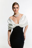Nur Karaata CULT Mia X Nur Karaata Buckingham gown featuring elegant fabric and intricate design, shown on a dress form.