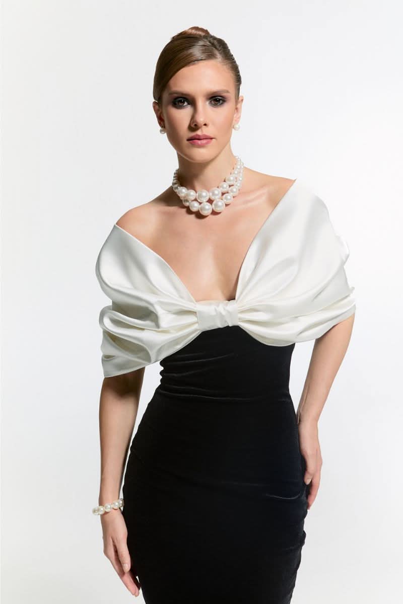 Nur Karaata CULT Mia X Nur Karaata Buckingham gown featuring elegant fabric and intricate design, shown on a dress form.