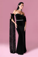 Nur Karaata Daisy Gown displayed on a hanger, featuring elegant fabric and intricate design, perfect for formal occasions.
