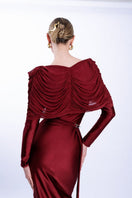 LEDIEL Dakota burgundy gown with flowing fabric and elegant design, perfect for formal occasions.