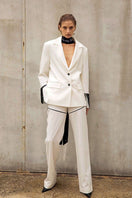 Vaska white blazer with beaded fringe detailing, tailored fit, and stylish design, perfect for a chic modern look.