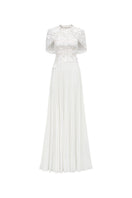 Elegant grain weave gown by Tracy Studio featuring intricate fabric texture and flowing silhouette.